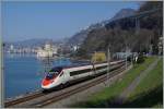 Internationaler Verkehr beim Château de Chillion: Ein SBB RABe 503 als EC 32 von Milano nach Genève fährt um 11.20 beim Châteu de Chillon vorbei.