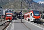 Zahlreiche Region Alpes EVO RABe 5 sind bereits Einsatz, so dass die RABe 525 NINA wohl in absehbarer Zeit aus dem Plandienst verschwinden werden, so dass es doch eine Aufnahme wert ist, beide Züge auf einem Bild zu sehen. 
Während der RABe 733 703 als R91 von Birg nach Monthey unterwegs ist, wartet der RABe 525 039 als R 81 auf die Abfahrt nach Le Châble. 

9. April 2026