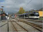  Regio Express  nach Prélaz und der Regionalzug 1428 nach Vevey warten in Blonay auf Abfahrt.