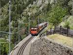 Deh II 96 Münster in der Kreiskehre von Grengiols mit einem Zug Richtung Andermatt.